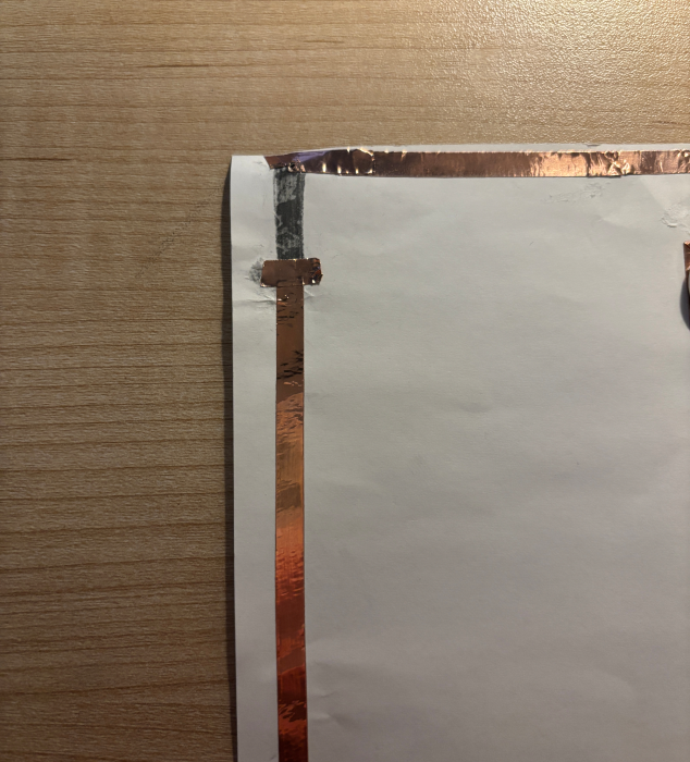 Close-up detail of a paper circuit.