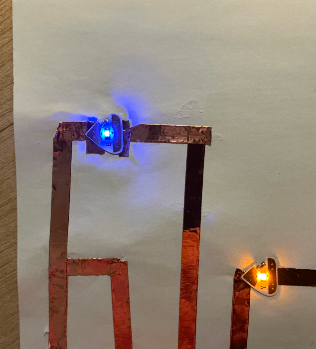 A close-up of blue and yellow LEDs in a circuit.