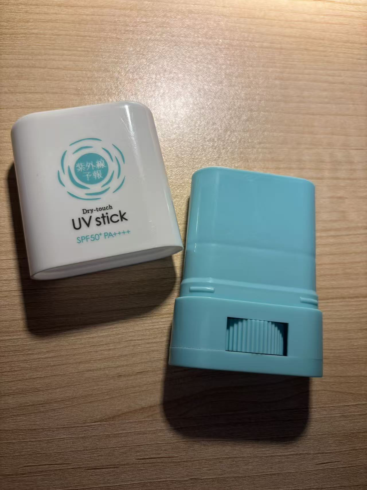 Disassembled components of a sunscreen stick.