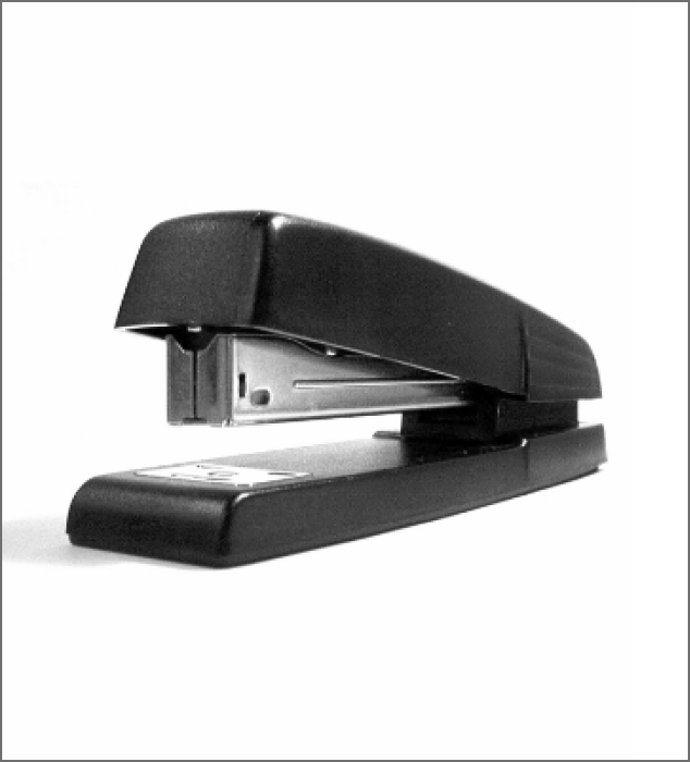 A black office stapler.
