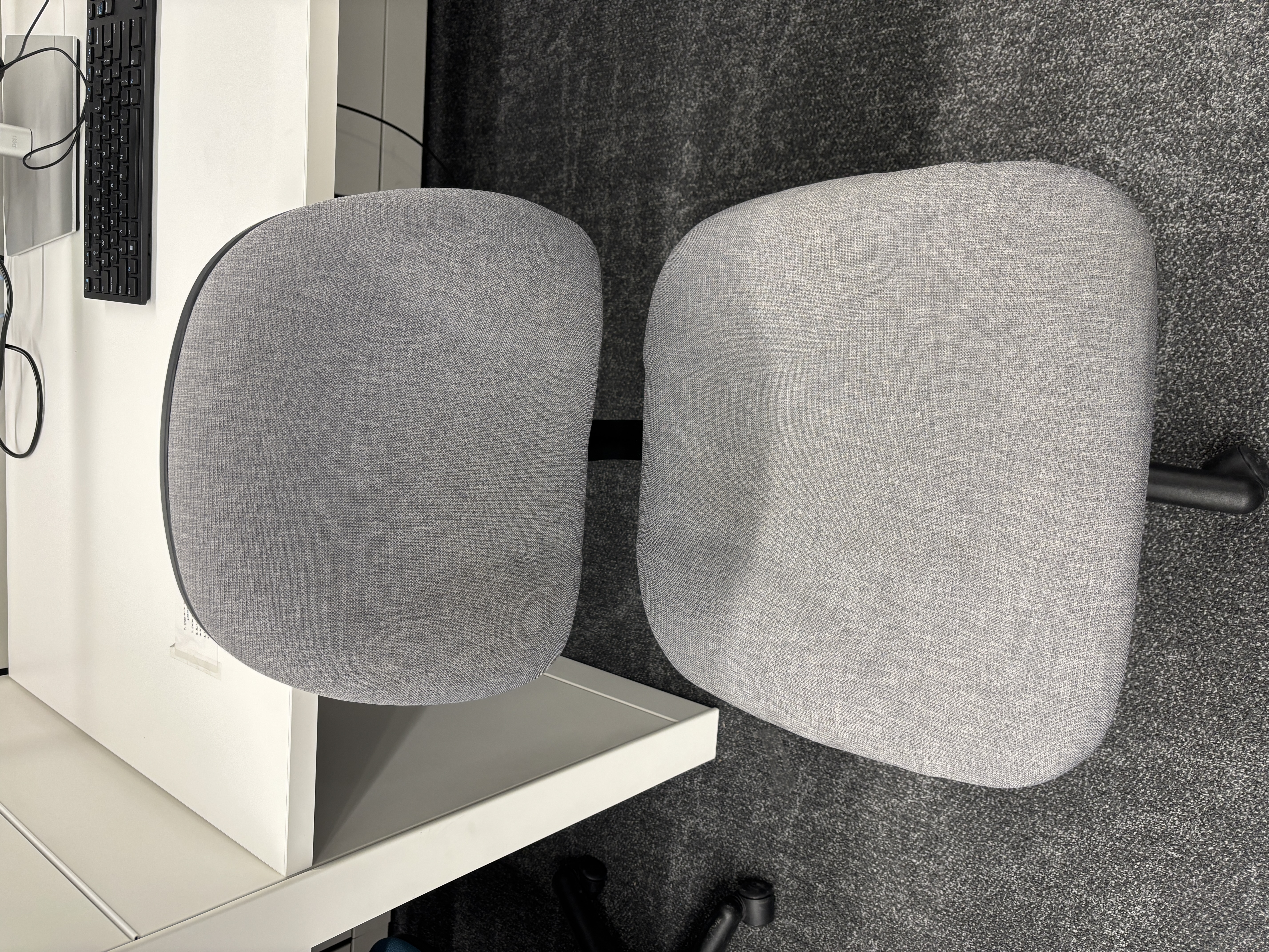 Library office chair with wheels that make a rolling friction sound when moved.