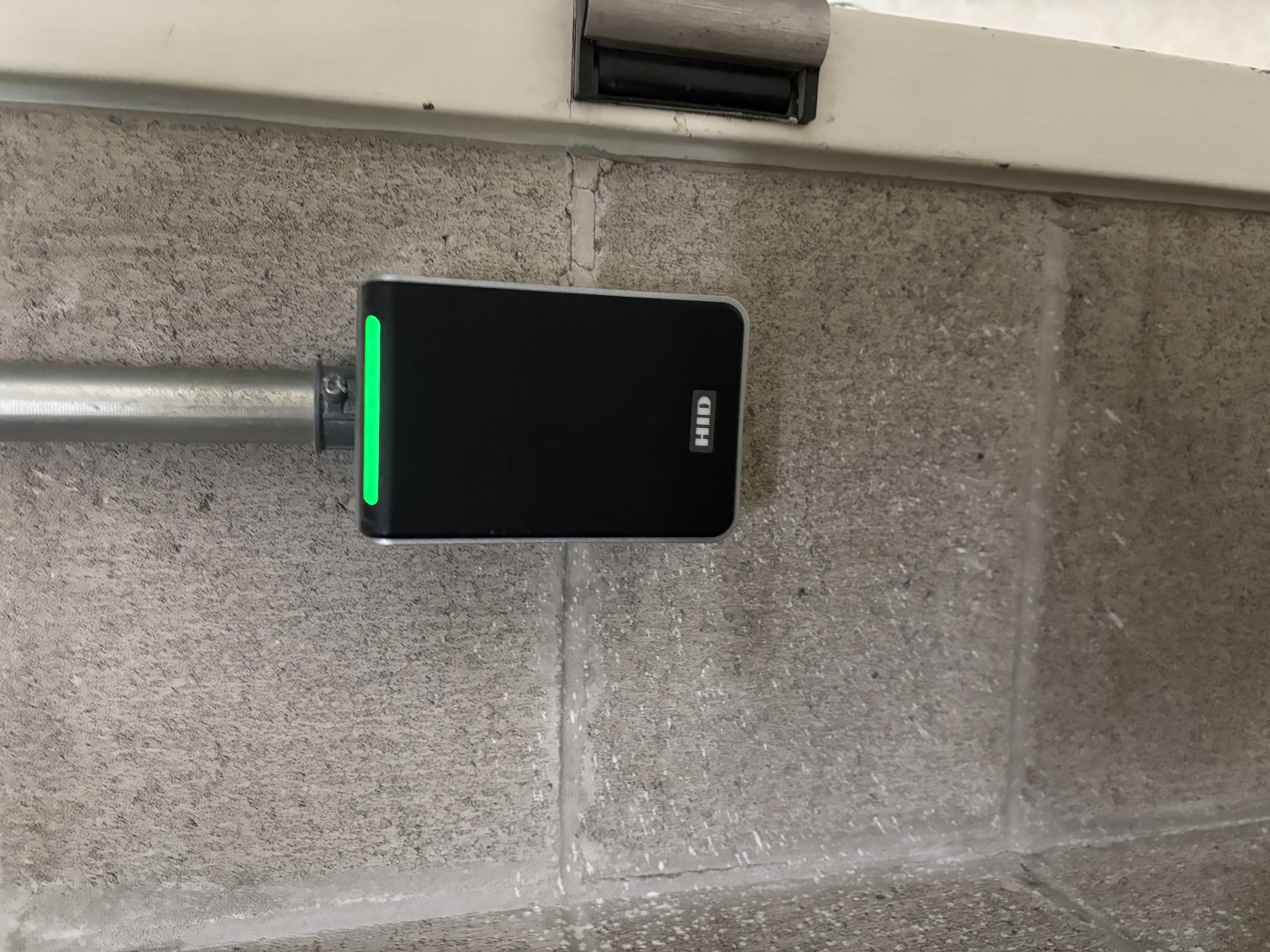 Mobile phone door lock that emits an electronic beep when swiped or unlocked.