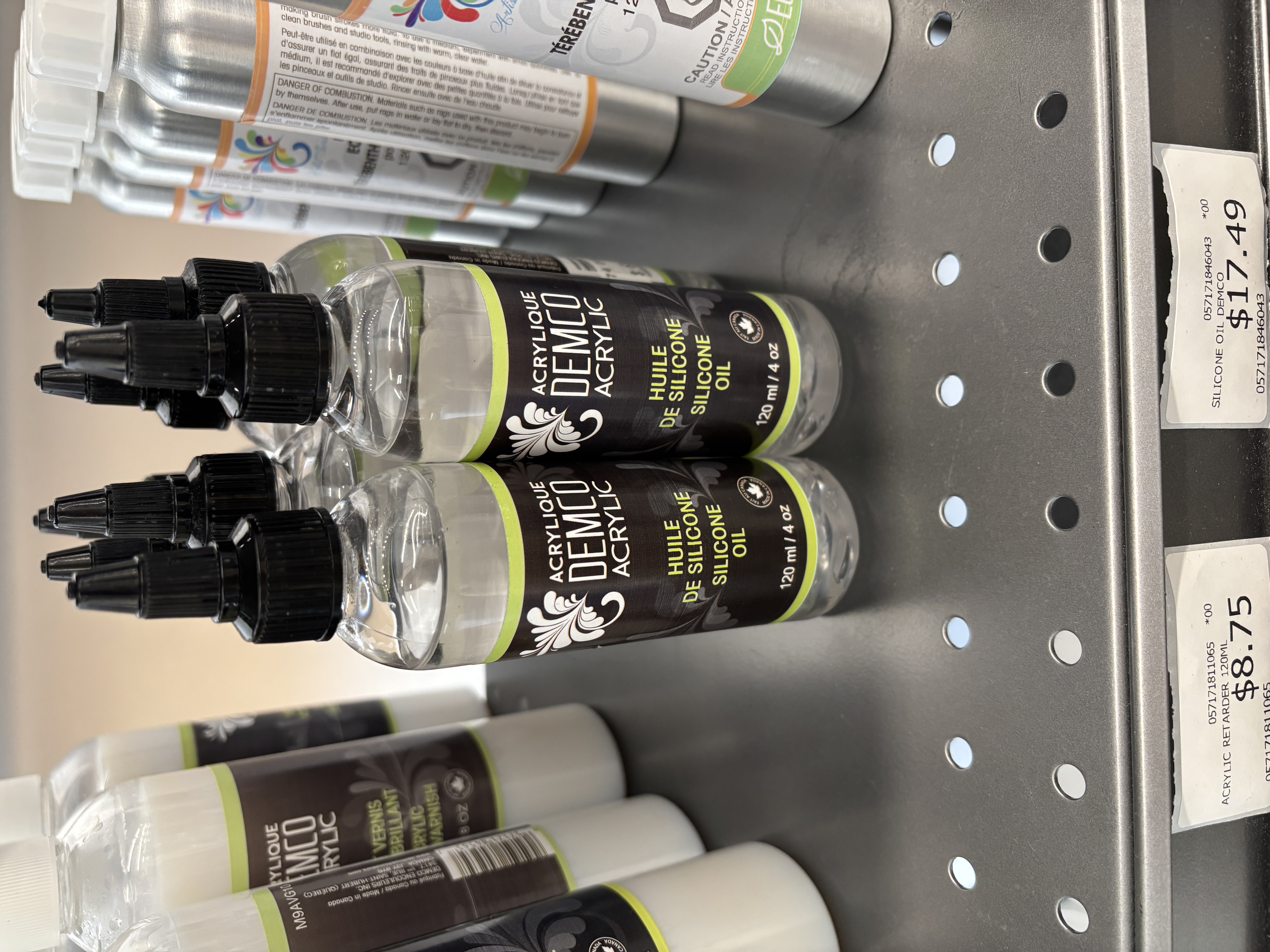 Spray bottle that makes a thudding sound when dropped from a shelf.