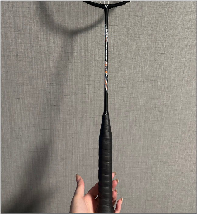 Front view of black badminton racket handle