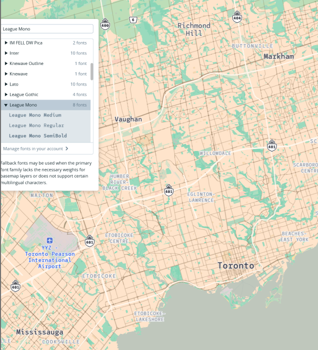The photo shows a screenshot of altered map fonts from the Mapbox website.